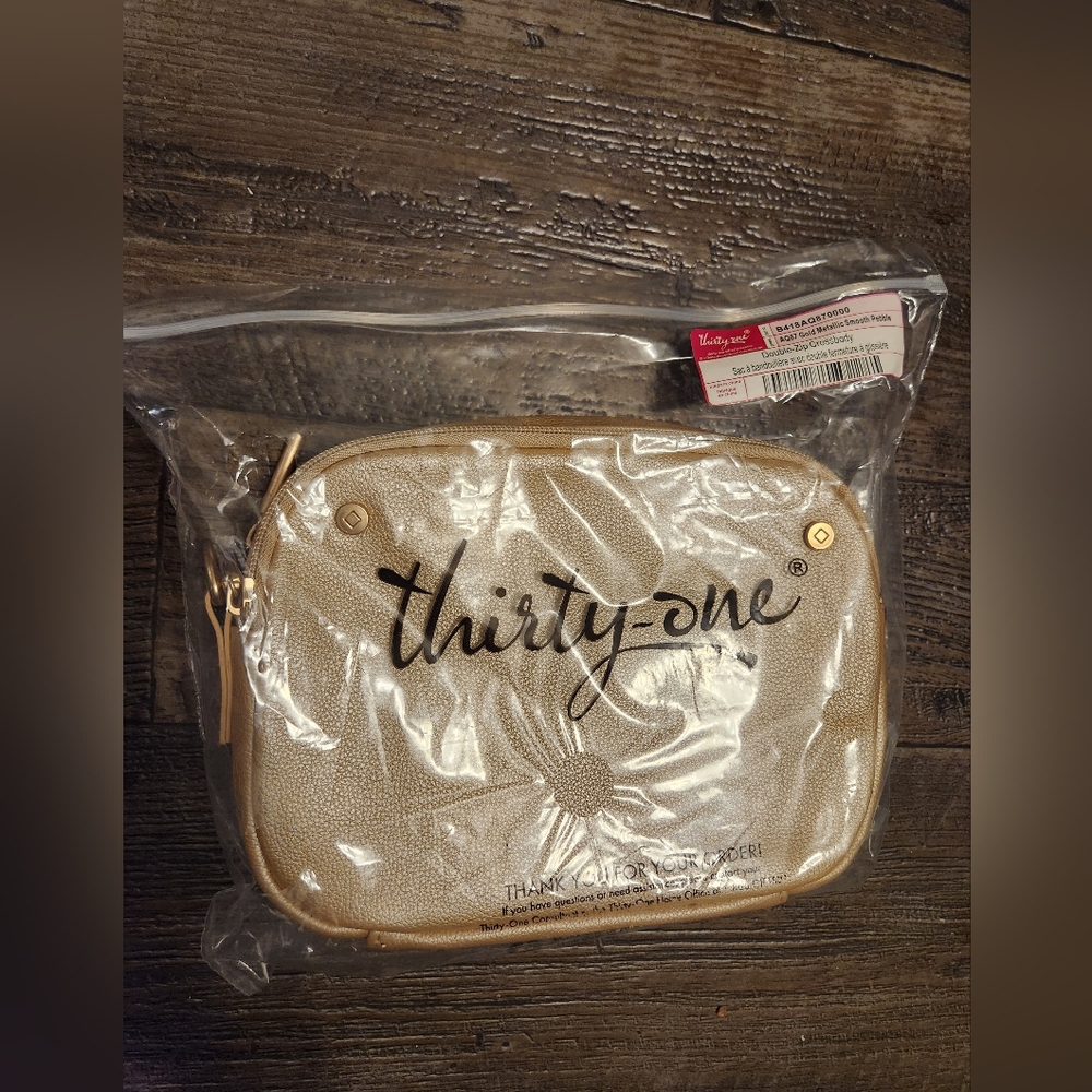 Thirty- one gold crossbody purse